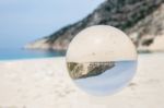 Crystal Ball On Sandy Greek Beach Stock Photo