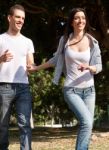 Young Couple Running Stock Photo