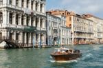 Motorboat Cruising Down The Grand Canal Stock Photo