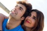 Portrait Of Young Couple Looking At The Horizon Stock Photo