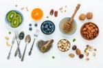 Ingredients For A Healthy Foods Background, Nuts, Honey, Berries Stock Photo