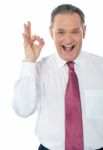 Businessman With Okay Hand Sign Stock Photo