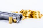 Gun Bullets And Money Showing A Dangerous Side To Life Stock Photo