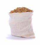 Paddy Dry Rice In Sack On White Background Stock Photo