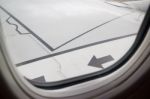 Wing Seat Seen Through Window Of An Aircraft Stock Photo