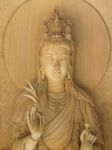 Kuan Yin Image Of Buddha , Wood Carving In A Thai Temple Stock Photo