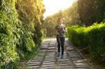 Women Runners Sprinting Outdoors. Sportive People In Public Park Stock Photo