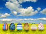 Many Colored Easter Eggs Over Blue Sky Background  Stock Photo