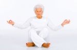 Elderly Woman Practicing Yoga Stock Photo