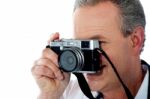 Mature Man Taking Photograph Stock Photo