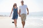 Love Couple Walk On The Beach Stock Photo