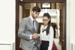 Businessman And Business Woman Reading Text Message Stock Photo