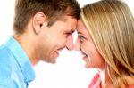 Smiling Couple Posing. Foreheads Touching Stock Photo