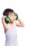 Boy In A White Singlet Wearing Earmuffs Stock Photo