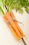 Baby Carrots Bunch Tied With Rope Stock Photo