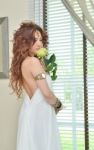 Lady In White Dress With Flower Stock Photo