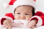 Little Girl With Santa Costume Stock Photo