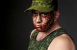 Military Style Camouflage On The Soldier's Face Stock Photo