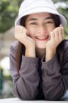 Thai Adult Girl White Cap Gray T-shirt Beautiful Girl Relax And Smile Stock Photo