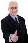 Businessman With Thumb Up Stock Photo