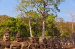 Statues Of Ancient Khmer Warrior Heads Carry Giant Snake Decorat Stock Photo