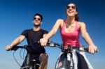 Happy Young  Couple On A Bike Ride In The Countryside Stock Photo