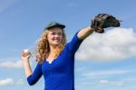 Young Woman Playing Baseball With Cap Glove And Ball Stock Photo