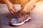 Hands Tying Shoes For Jogging Stock Photo