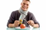 Smiling Man Going To Eat Apple With Fork And Knife Stock Photo