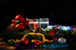 Two Glasses Of Champagne With A Christmas Decor In The Background Stock Photo