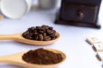 Wooden Spoons Filled With Coffee Bean And Crushed Ground Coffee Stock Photo