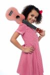 Atttactive School Girl With Toy Guitar Stock Photo