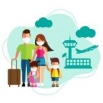 Family Tourism With Surgical Mask Face Protection At Airport Stock Photo