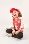 Little Girl Fashion Model With Red Cap Stock Photo