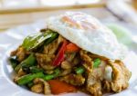 Stir Fried Pork With Curry Paste Serve With Fried Egg Stock Photo