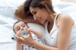 Mother And Baby Playing And Smiling At Home Stock Photo