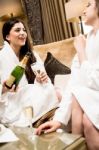 Young Ladies Having Great Time In Hotel Room Stock Photo