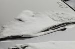 Parked Car Covered With The First Snow In Winter Stock Photo