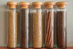 Assortment Of Spices In Glass Bottles Stock Photo