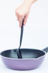 Hand With Non Stick Frying Pan On White Background Stock Photo