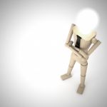 The Wooden Doll With Light Bulb Stock Photo