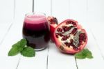 Fresh Tropical Pomegranate Juice Isolated On A White Background Stock Photo