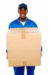 Delivery Boy Holding Cardboard Box Stock Photo