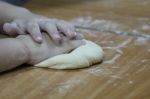 A Little Boy Makes Dough Stock Photo