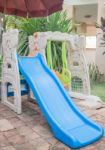 Home Playground Swing Set In Garden Stock Photo