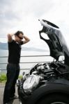 Sad Man Looking At His Broken Car Stock Photo