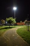 Night Public Park In The City With Houses Near Stock Photo