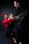 Young Flamenco Dancers In Beautiful Dress On Black Background Stock Photo