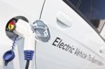 Electric Car Charging Stock Photo