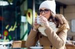 Portrait Of Young Beautiful Woman Drinking Coffee Outdoor Stock Photo